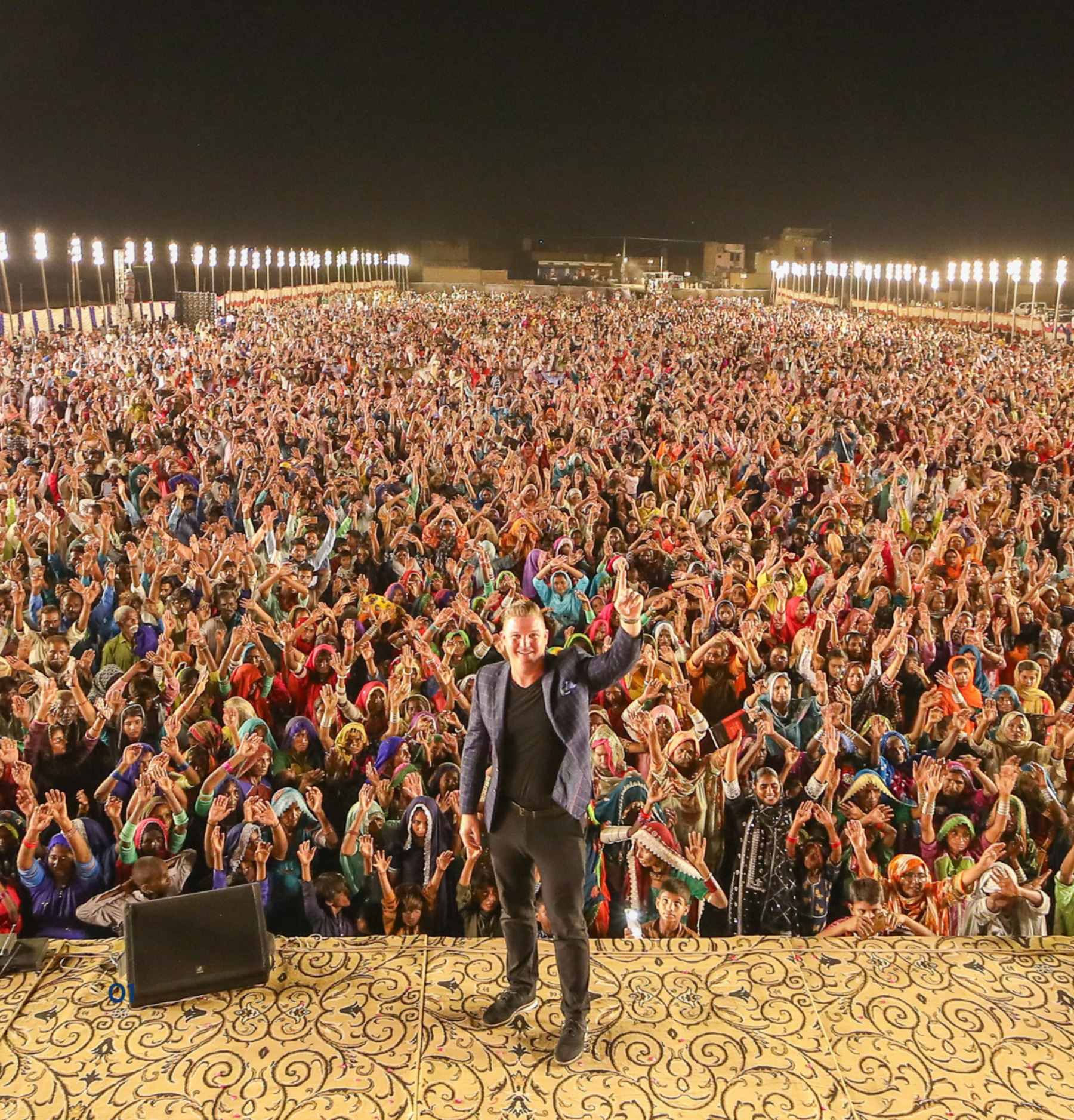 A large Gospel crusade crowd responding to the Gospel